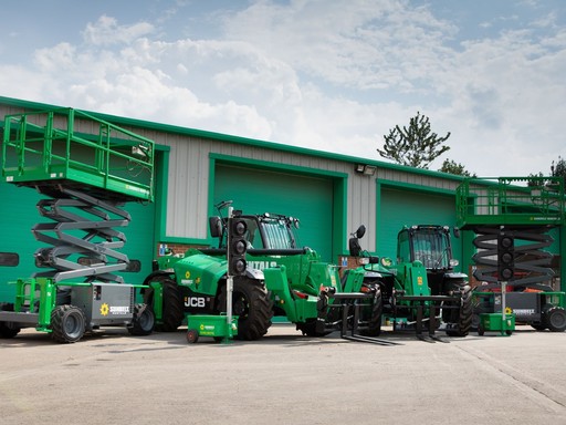 Sunbelt Rentals branded plant and powered access equipment outside a depot.