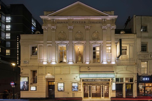 Front on view of Harold Pinter Theatre at night