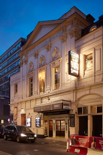 lose up of the entrance to Harold Pinter Theatre at dusk