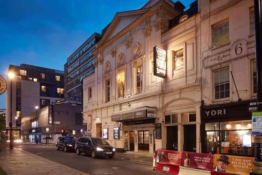 Side on of Harold Pinter Theatre at dusk