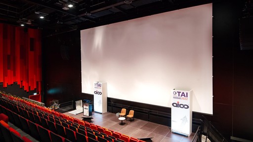 Swansea Arena conference stage space with operable wall and screen in place