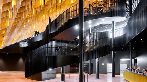 Swansea Arena Level 0 Concourse space, with winding staircase and kriskadecor ceiling, empty