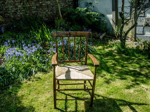 Rush seated chair with bluebells