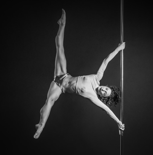 Pole dancer strength move Iron X