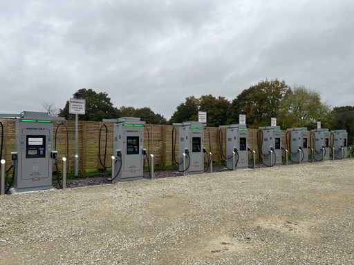 Six InstaVolt ultra-fast EV chargers, each with 160kW capacity, lined up at Frankies Farm Shop in Staplehurst, set against a wooden fence with clear signage indicating rapid EV charging