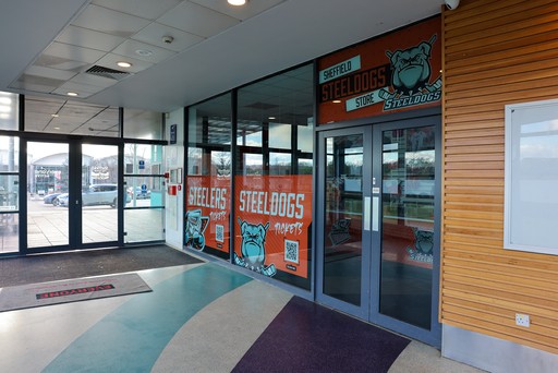 Sheffield Steeldogs store entrance with large bulldog logo and orange signage.