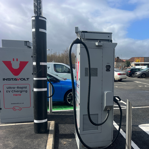 Close-up of InstaVolt ultra-rapid EV charger with parked electric car at McDonald’s in Barrhead.
