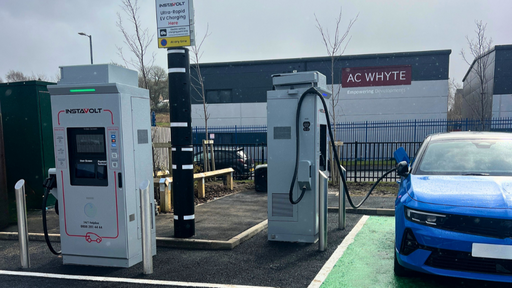 Wide view of InstaVolt EV chargers and parking area at McDonald’s Crossmill Business Park Barrhead.