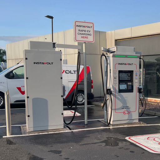 Dual InstaVolt rapid chargers are installed in a clean, accessible car park in McDonald's Middlesbrough, supported by clear signage and visible branding on service vehicles.