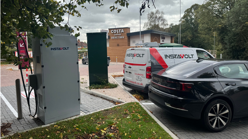 Electric vehicles are plugged into InstaVolt ultra-rapid chargers next to Costa Coffee Drive Thru at Topaz Business Park, Bromsgrove. The location is clearly signposted and features branded InstaVolt support vehicles, making it convenient for drivers to recharge while enjoying refreshments.