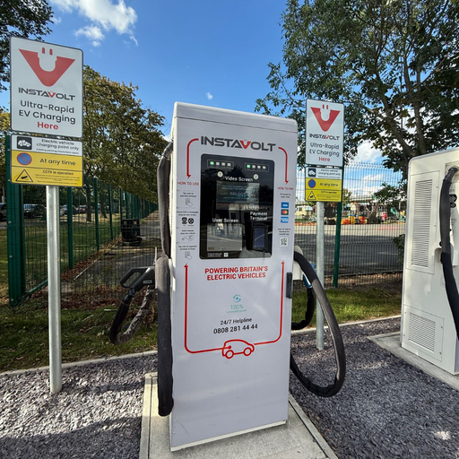 Front view of an InstaVolt ultra-rapid charger at Mile House, Stockton-On-Tees, with visible instructions and safety signage.