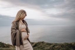 Maternity photo cliffs of moher blond haired woman