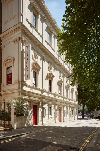 Side of the Kit Kat Club at the Playhouse Theatre building and adjacent road
