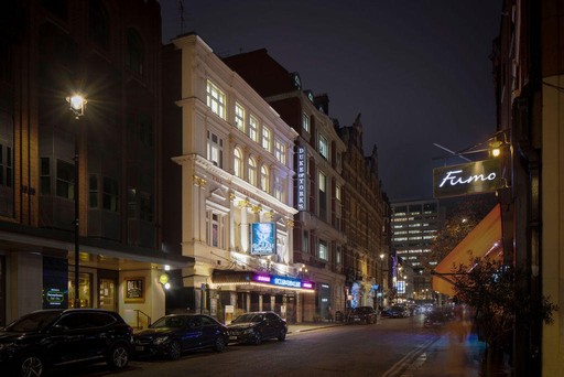 Side view of the Duke of York's theatre at night