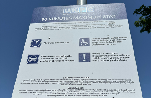 Parking information sign at the McDonald's Leicester InstaVolt charging location, displaying a 90-minute maximum stay and customer parking conditions to help EV drivers understand the site rules.