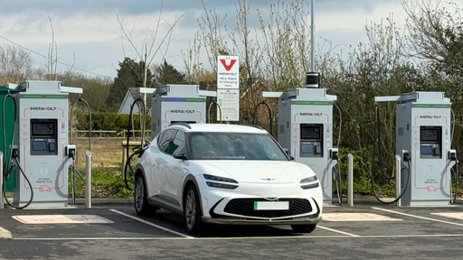 EV charging in progress at InstaVolt hub with modern vehicle connected.