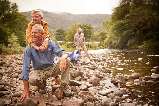 Grandparents explore the banks of the river Eachaig with their grandchildren at Stratheck