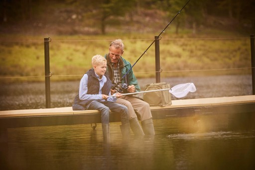 Grandfather fishing with his grandson in Lock Eck at Stratheck