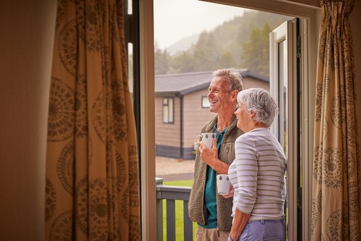 Retired couple admire the view from their lodge at Stratheck