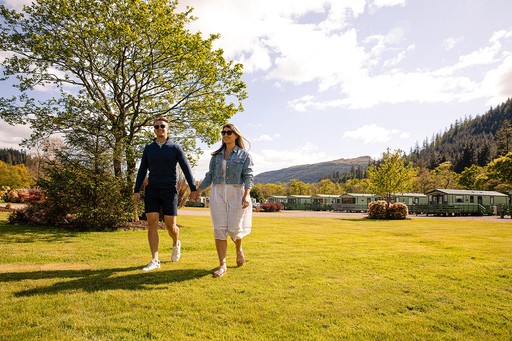 Couple take a stroll around the grounds of Stratheck Holiday Park