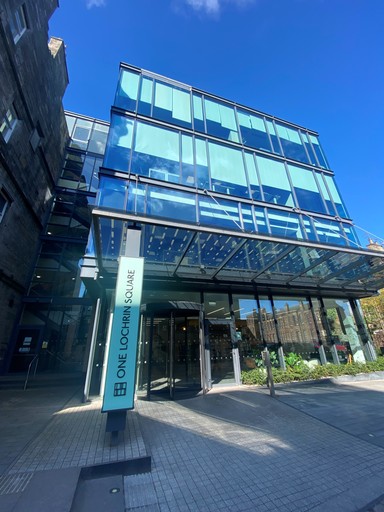 In front of building