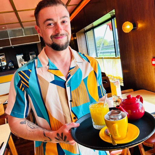 Brightside Team serving tea and orange juice