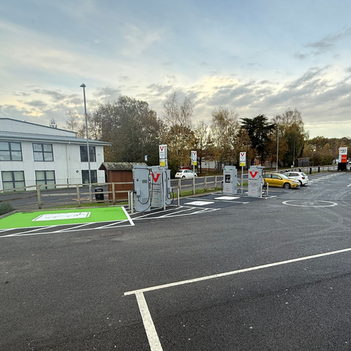 Wide-angle view of InstaVolt charging bays located at Marks and Spencer in Ashdown Business Park, Uckfield, with clear EV markings and signage for ultra-rapid charging.