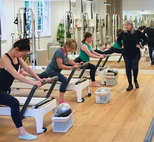 Anna cueing a group Reformer class, Edinburgh
