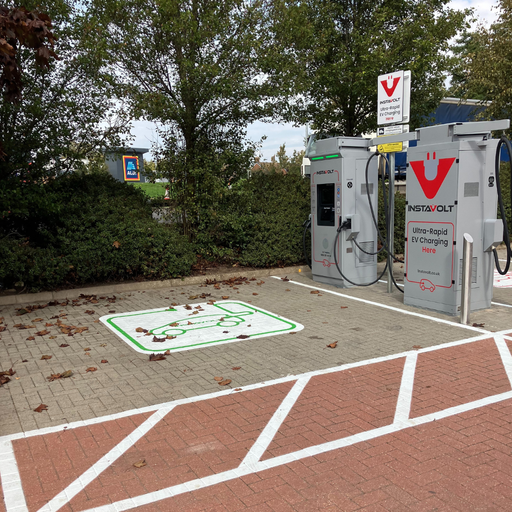Twin InstaVolt ultra-rapid chargers situated near an Aldi store, ideal for topping up your EV while grocery shopping in Northampton.
