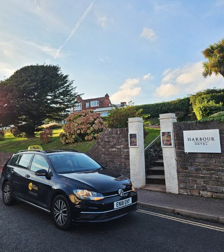 Sidmouth taxi in the front of Harbour Hotel Sidmou