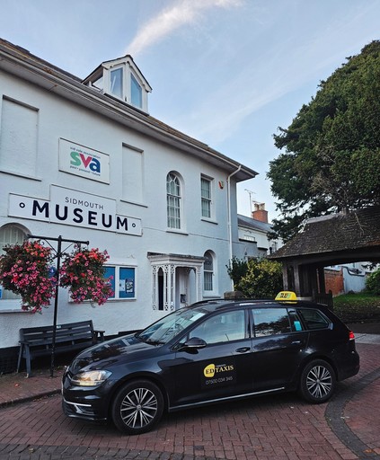 Sidmouth taxi in the front of Sidmouth Museum