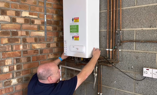 Derby Boiler Engineer Replacing Parts on Boiler