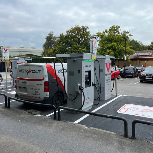 An InstaVolt electric van charges at ultra-rapid InstaVolt chargers in a popular retail area on Tollbar Way, Southampton, next to McDonald's.