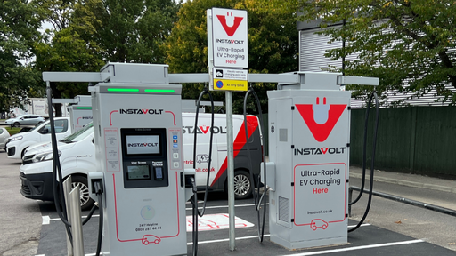 Front-facing view of InstaVolt ultra-rapid EV charging bays in Southampton, featuring clear signage and branding within a well-marked retail car park.