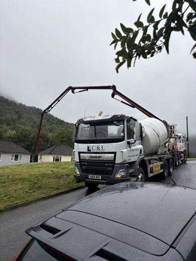 Delivering ready mix concrete to rear garden 