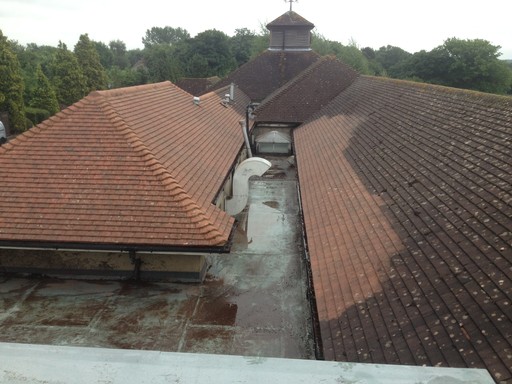 A roof that has been half cleaned