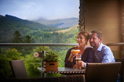 Couple enjoy drinks and panoramic views at The View Bar and Restaurant