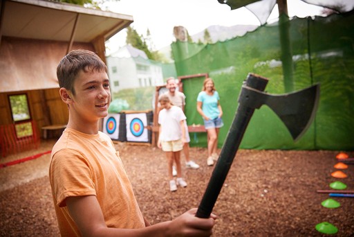 Family taking part in Axe Throwing with our Go Cove team