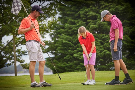 Family playing on the 9-Hole Golf Course at Drimsynie Estate