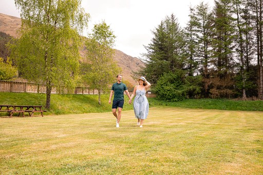 Couple stroll around the grounds of Loch Awe Holiday Park