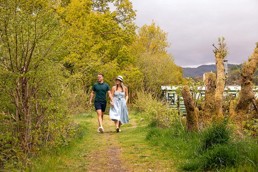 Couple stroll around the grounds of Loch Awe Holiday Park