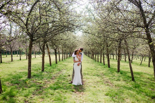 Couple with their arms wrapped around each other