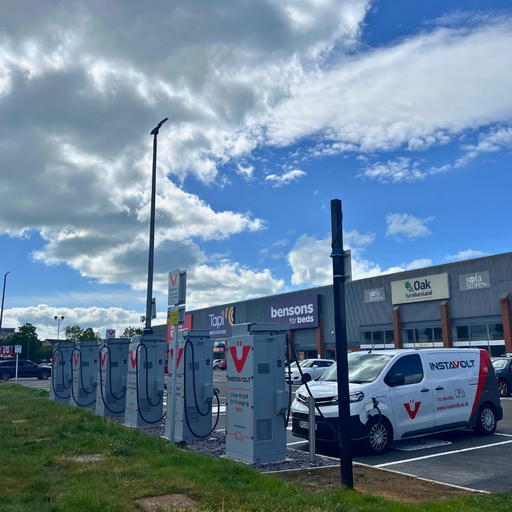 InstaVolt charging hub at Lottbridge Drove Retail Park in Eastbourne with nearby furniture and home retail stores.