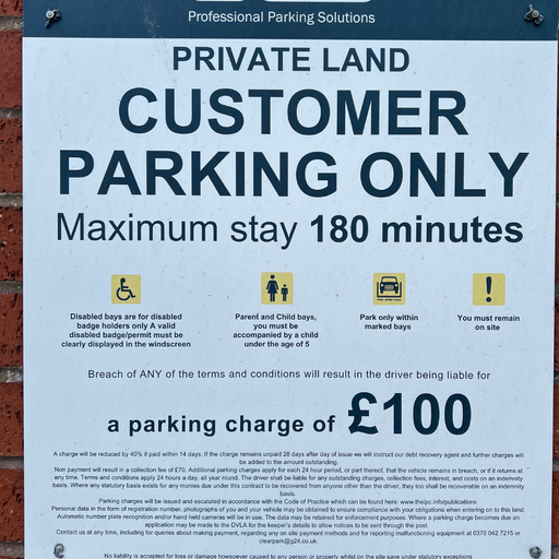 Parking information sign displaying customer parking rules and maximum stay details at the Eastbourne retail park.