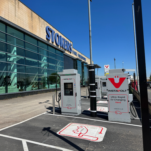 Ultra rapid EV charging units outside Stokers Fine Furniture in Chester with convenient parking and roadside access.