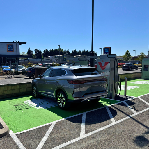 Electric vehicle charging in use at Stokers Furniture Chester, close to ALDI with accessible bays and easy access.