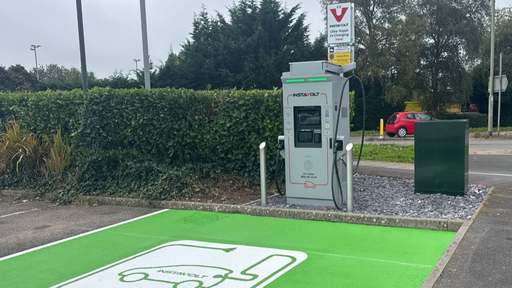 A wider view of the InstaVolt charging station at Exe Valley Leisure Centre, Tiverton, featuring a dedicated green EV bay and ultra-rapid charger with clear signage and easy access.