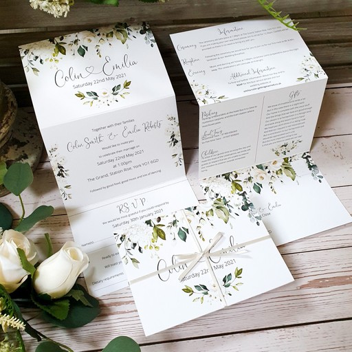 folded invite white roses