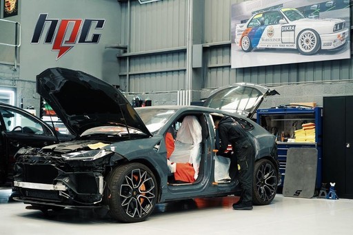 Automotive maintenance station and equipment setup - Professional auto body shop facility with specialized tools and machinery for collision repair and restoration work