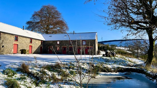 View of barn in the snow